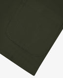 Front close up shot of Uskees dark green cotton drill blazer for men showing one of the front pockets.