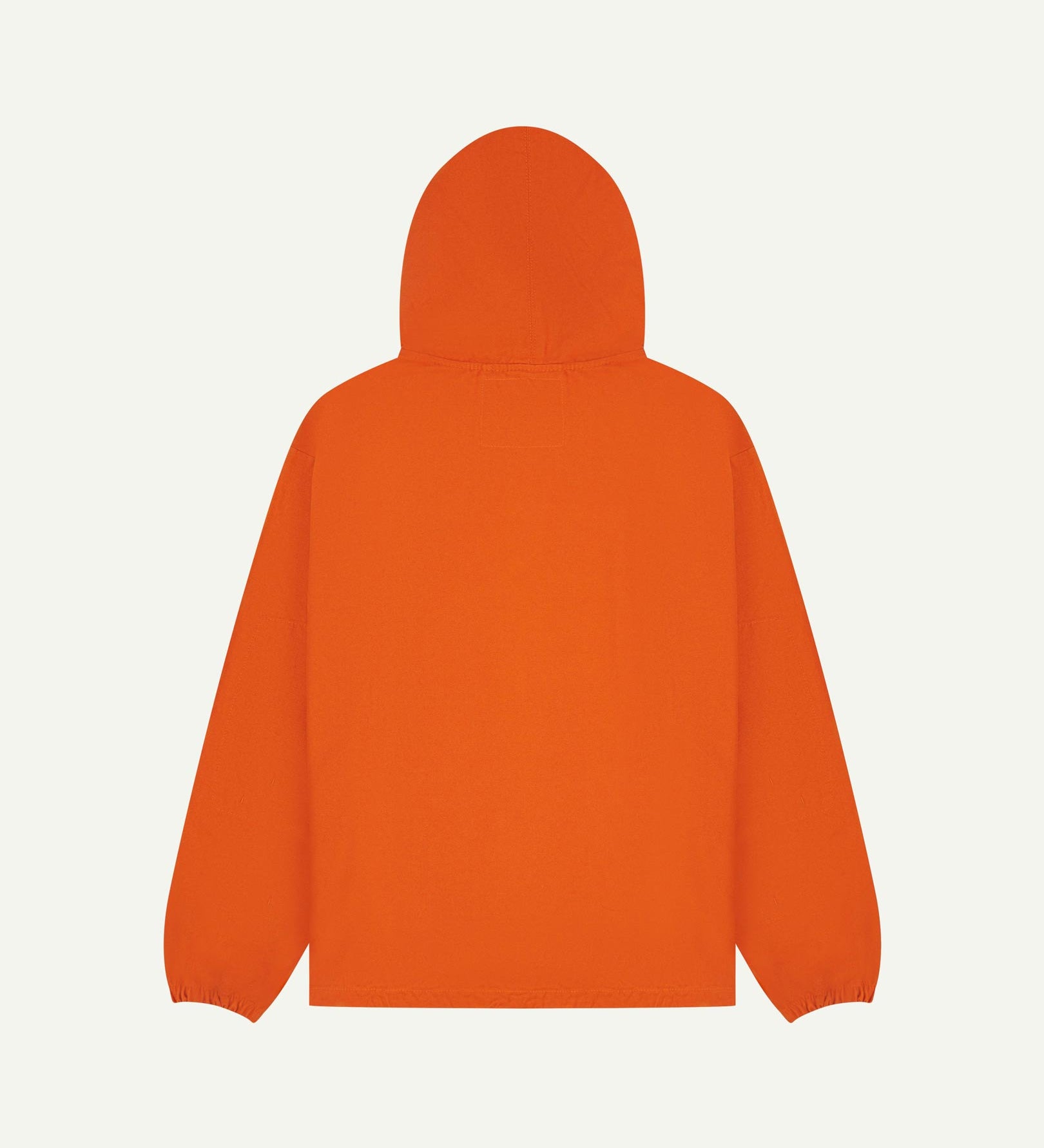 Back flat shot of Uskees gold-orange organic cotton smock showing reinforced elbows, back of hood and loose silhouette.