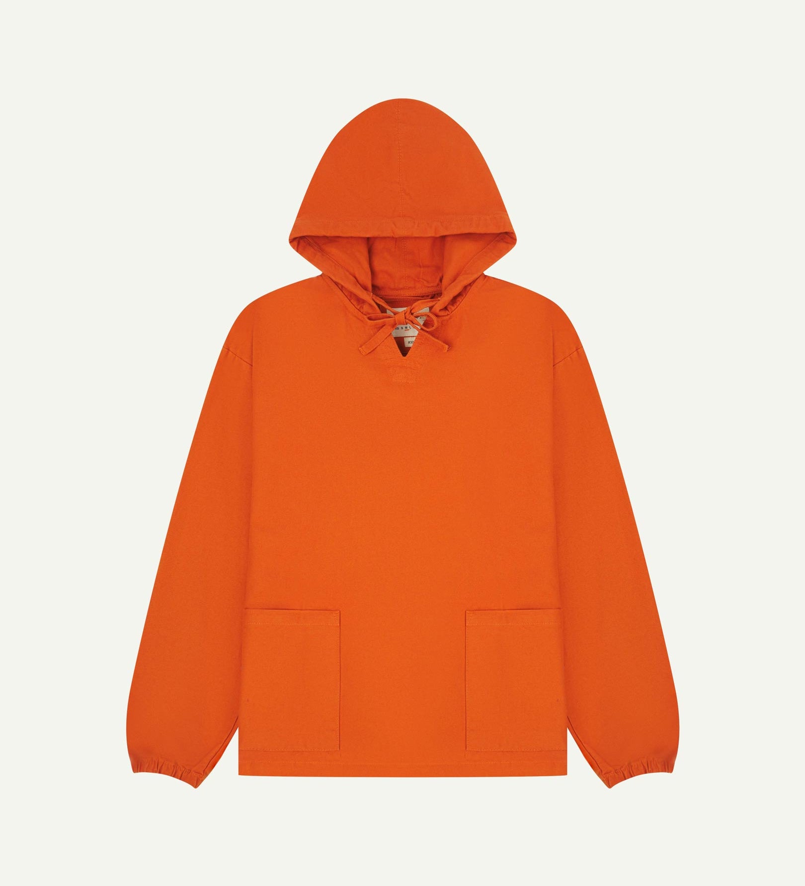 Full-length front flat view of gold-orange smock from Uskees, showing large front hip pockets, drawstring base and hood.