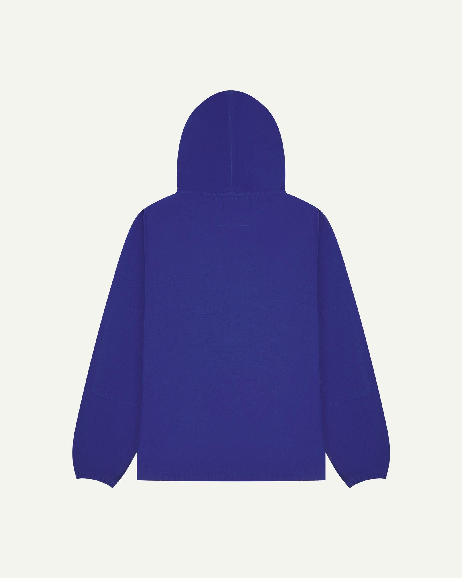 Back flat shot of Uskees ultra blue organic cotton smock showing reinforced elbows, back of hood and loose silhouette.