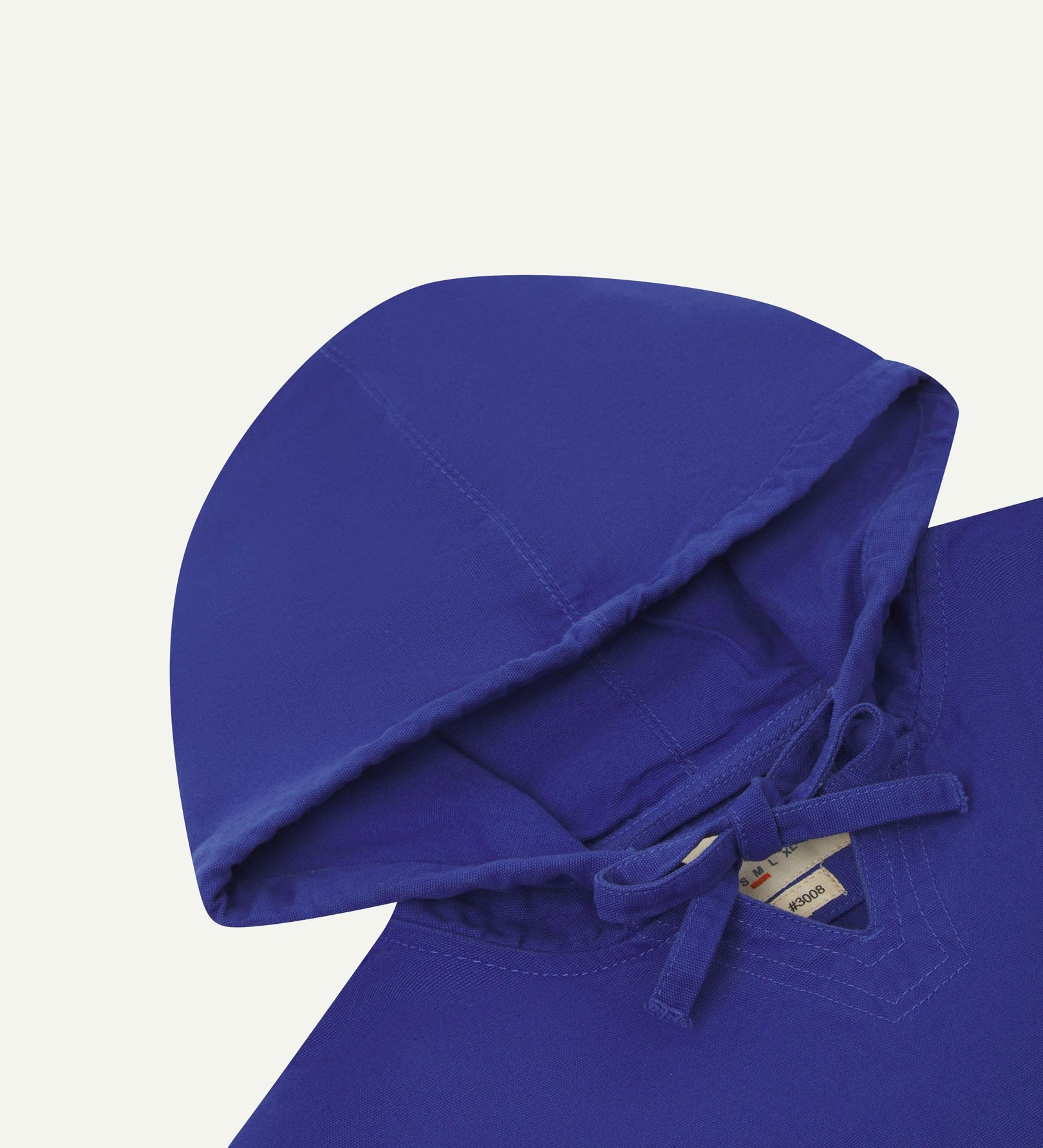 Closer look at the hood of the Uskees organic cotton smock in ultra blue showing hood, hood drawstring and quadruply stitched neck area.
