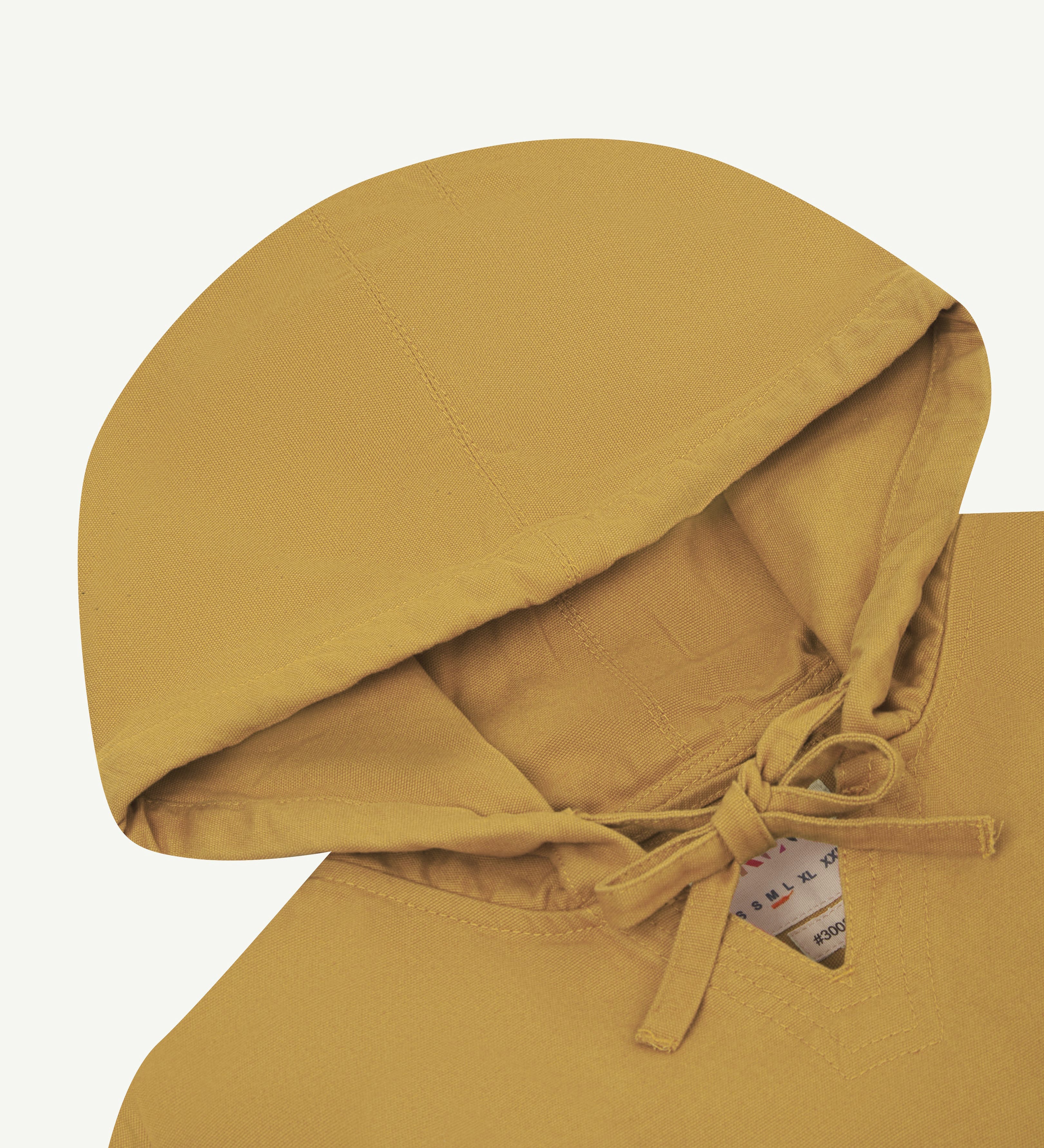 Detail shot of uskees yellow men's organic cotton smock showing hood and neck tie detail