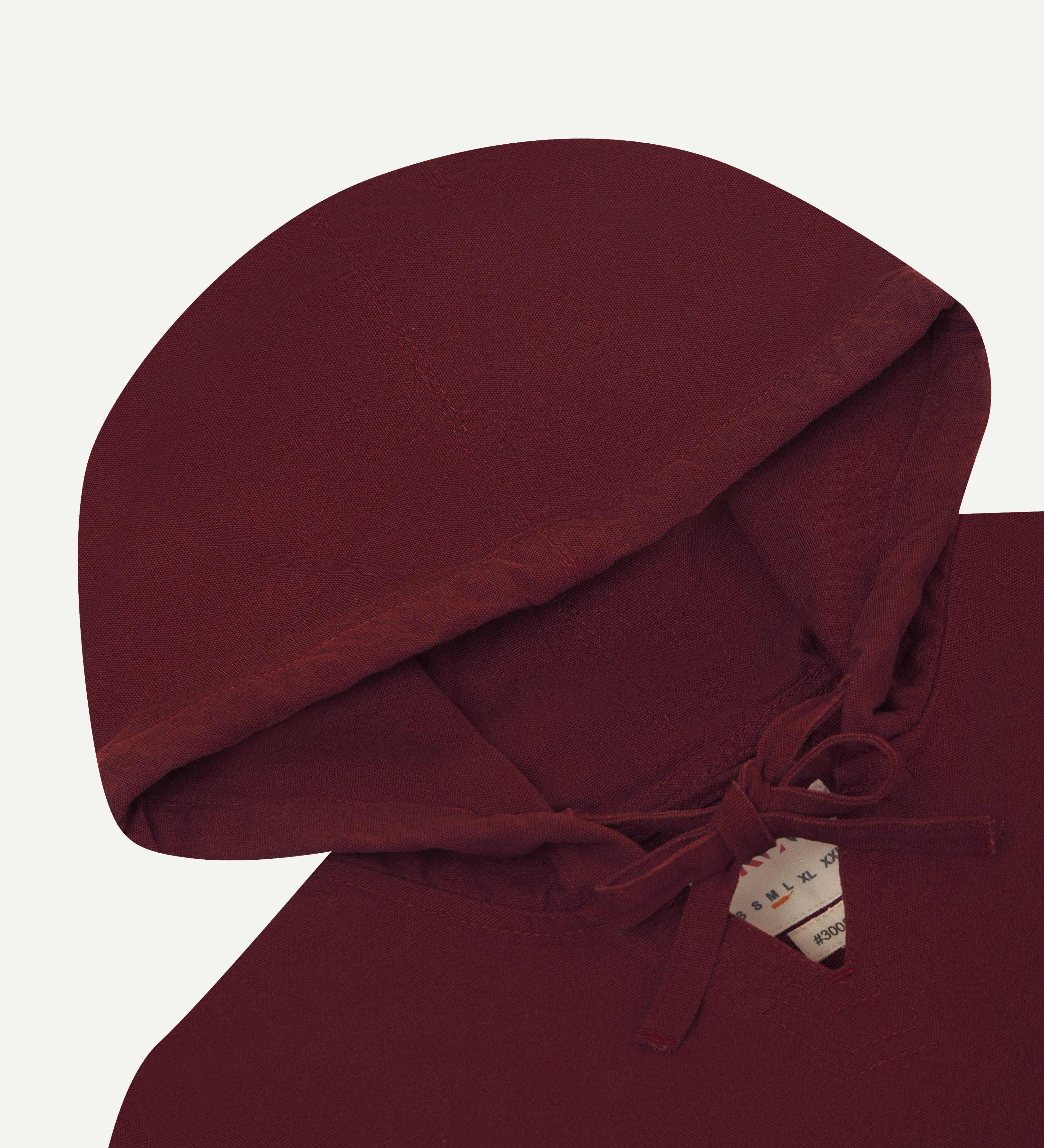 front close shot of uskees dark red men's organic cotton smock showing hood.