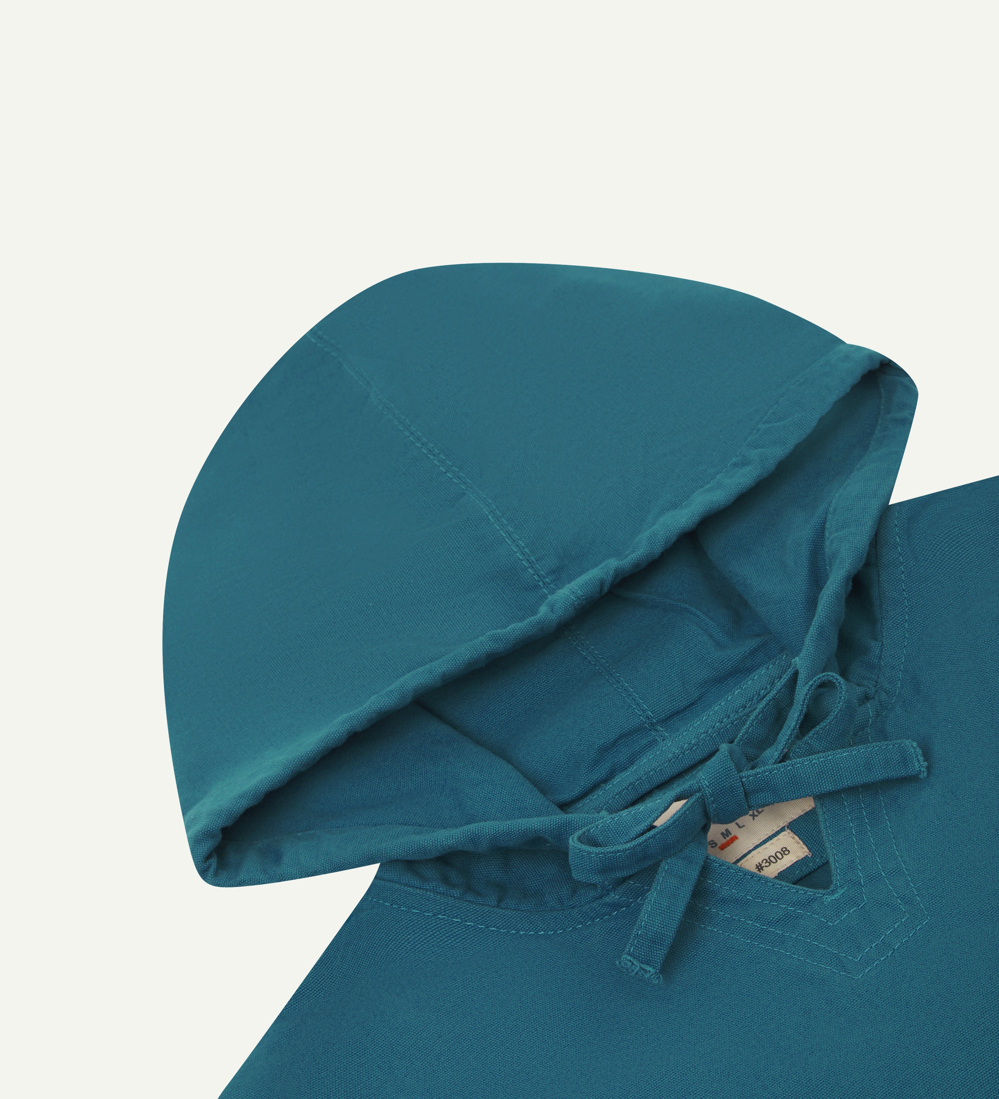 Close front flat shot of uskees mid-blue men's organic cotton smock showing hood.