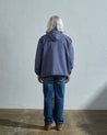 Full-length back view of man modelling USKEES teal 3012 button-front smock.