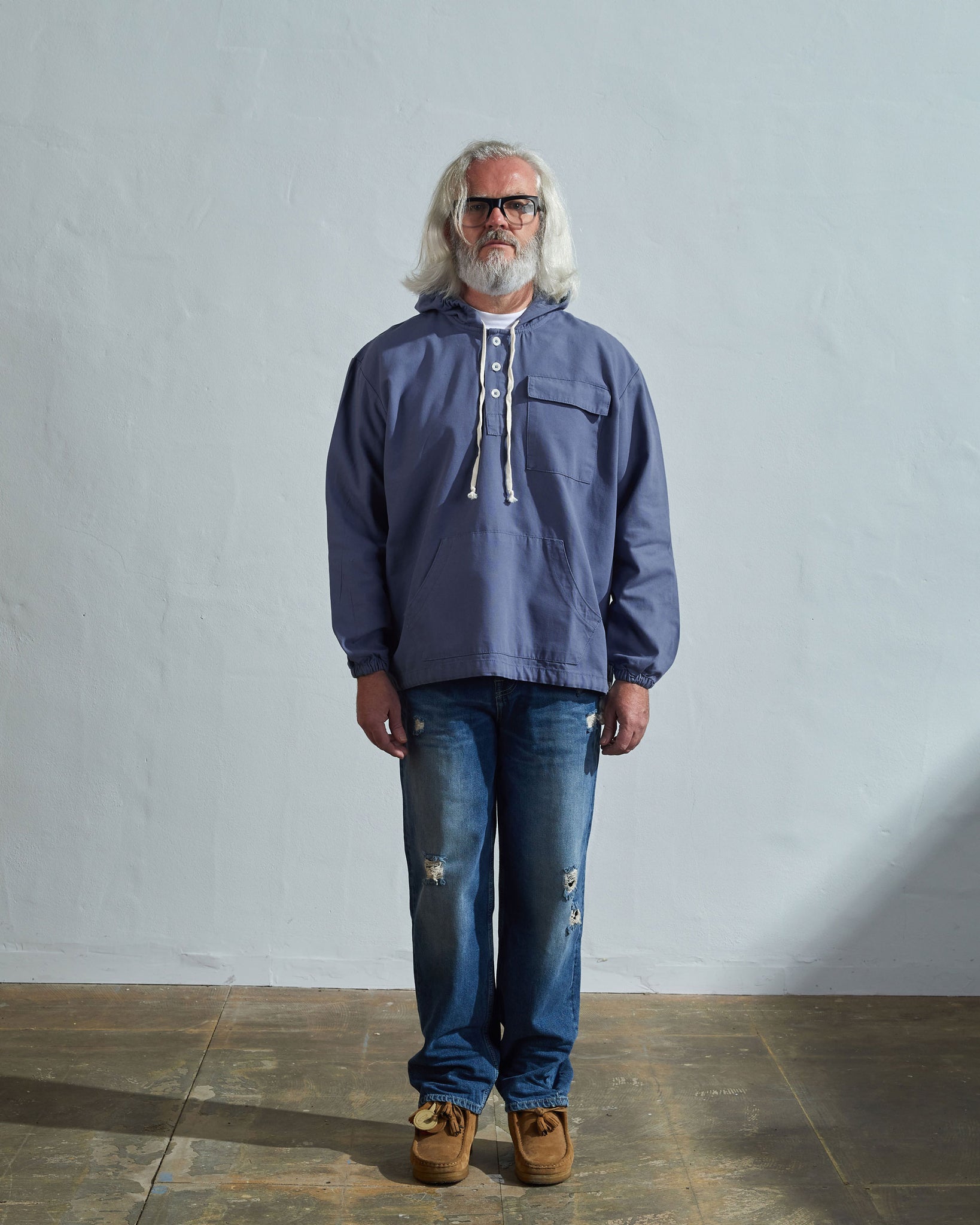 Full-length front view of male modelling USKEES teal 3012 button-front smock.