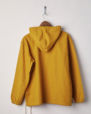 Back view of yellow coloured buttoned smock from Uskees with view of hood. Presented on hanger with white backdrop.