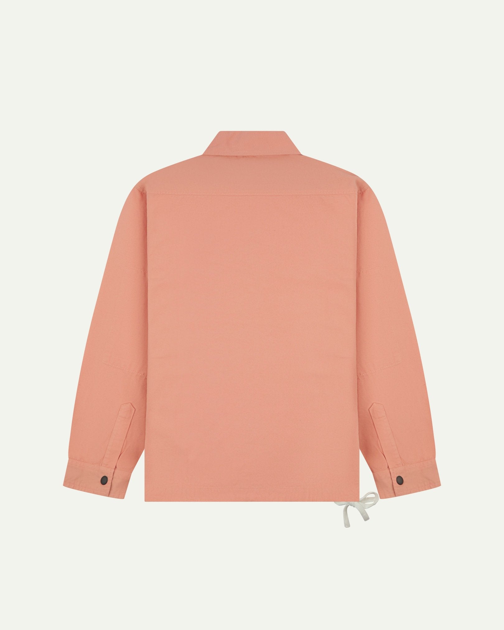 Full back view of Uskees pink-orange (coral) organic cotton coach jacket showing reinforced elbows and simple design.