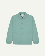 Full front view of Uskees eucalyptus-green organic cotton coach jacket with 2 patch pockets and drawstring base.