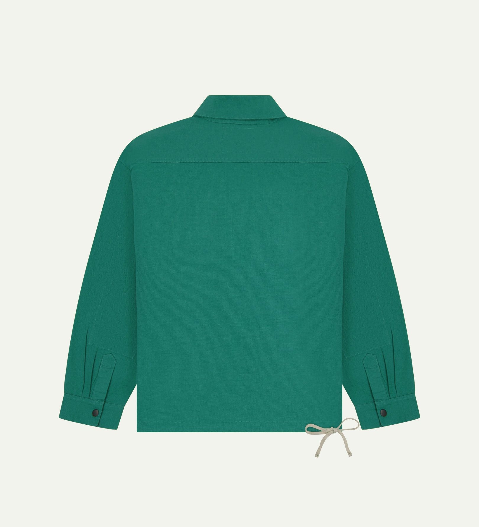 Full back view of Uskees foam green organic cotton coach jacket showing reinforced elbows and simple design.