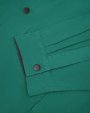 Sleeve view of Uskees 3013 foam green organic cotton coach jacket with focus on placket, cuff and popper buttons.