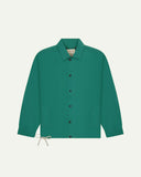 Full front view of Uskees foam green organic cotton coach jacket showing sharp, contemporary detailing including 2 patch pockets, drawstring base and popper fastening.