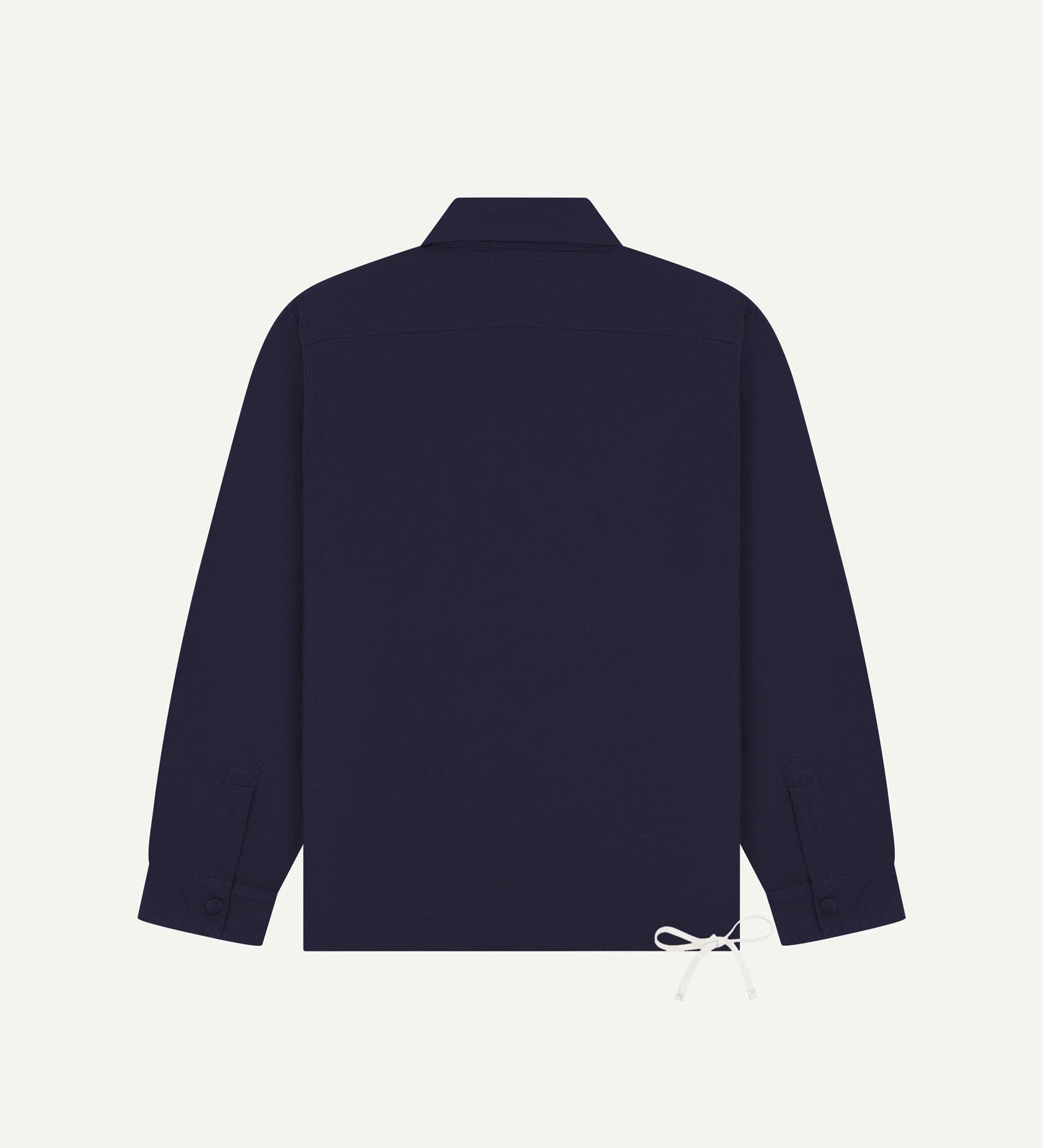 Full back view of Uskees dark blue organic cotton coach jacket showing reinforced elbows and simple design.