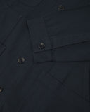 Closer detail view of multiple layered patch pockets, cuff detailing, corozo buttons and extra durable weave of the organic cotton drill fabric.