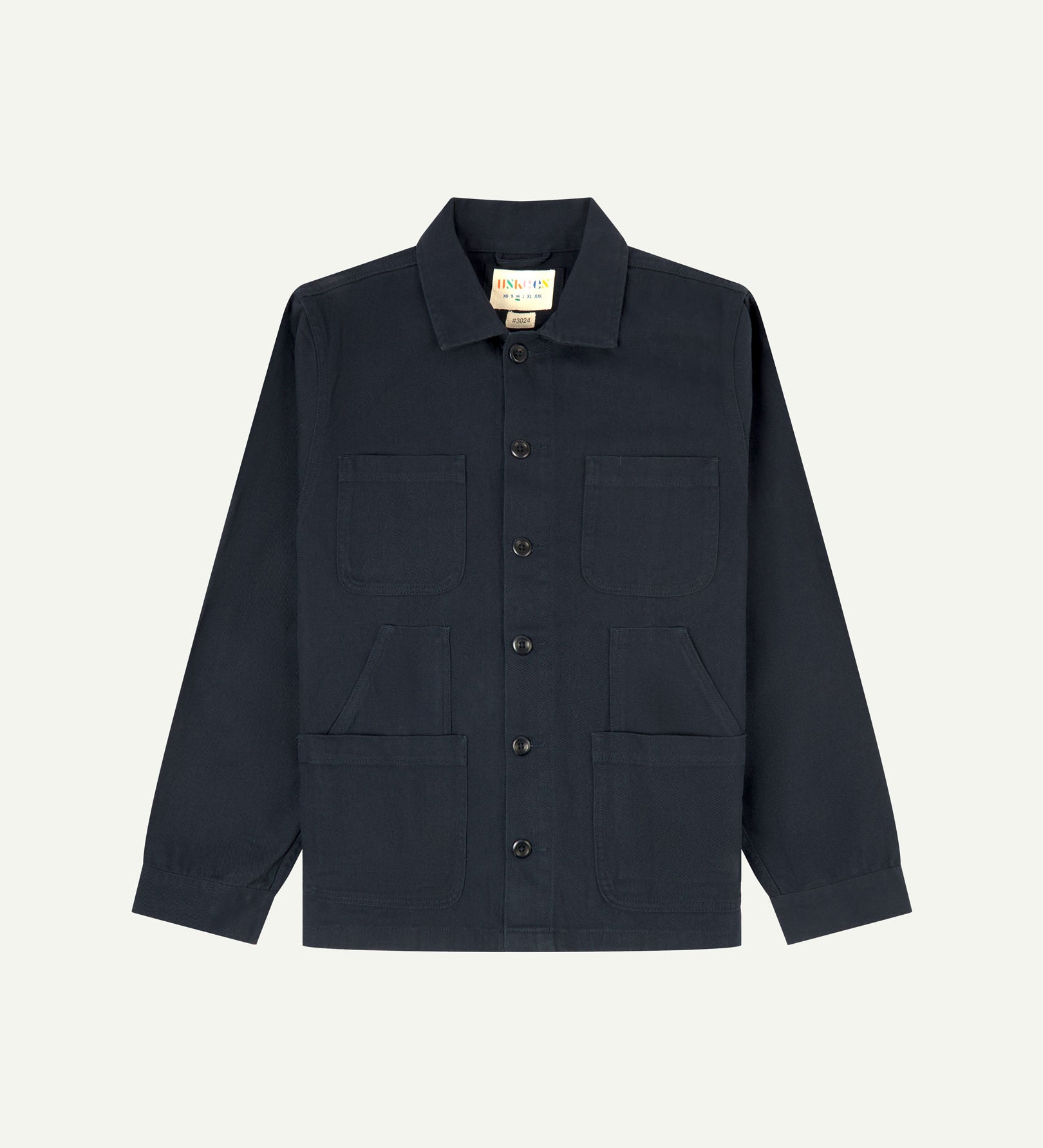 Dark blue (blueberry) buttoned organic cotton-drill overshirt from Uskees with clear view of layered patch pockets, reinforced elbows and Uskees branding label.