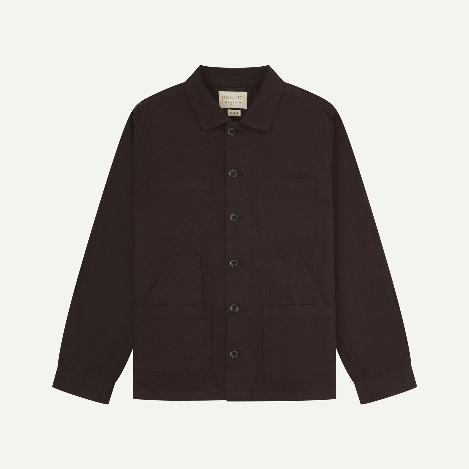 Burgundy-brown buttoned organic cotton-drill overshirt from Uskees with clear view of layered patch pockets, reinforced elbows and Uskees branding label.