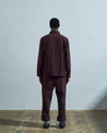 Full-length rear view of #3024, dark plum-coloured organic cotton-drill over shirt with reinforced elbows.