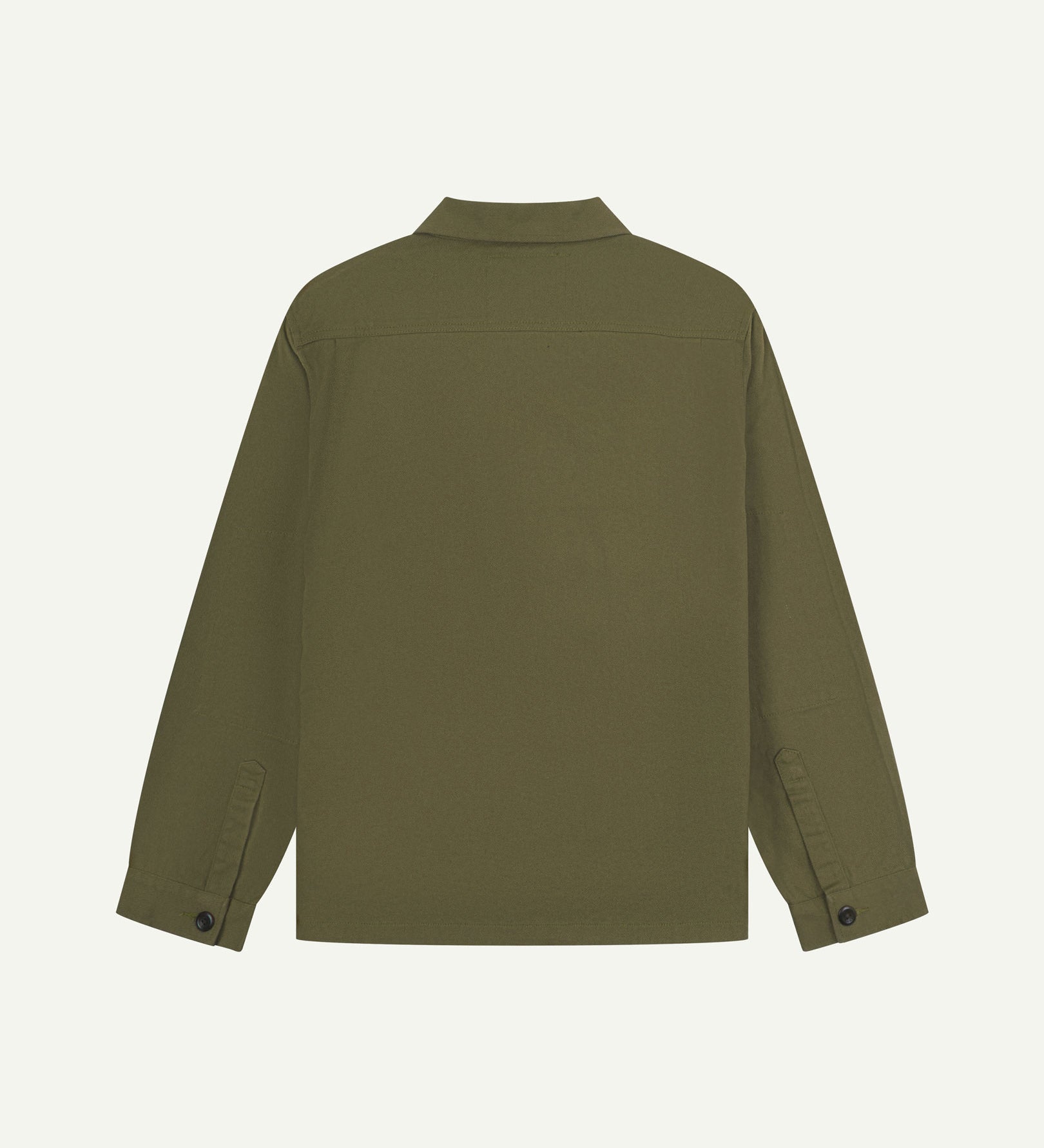 Reverse of moss-green buttoned organic cotton-drill overshirt from Uskees showing reinforced elbows and boxy silhouette.