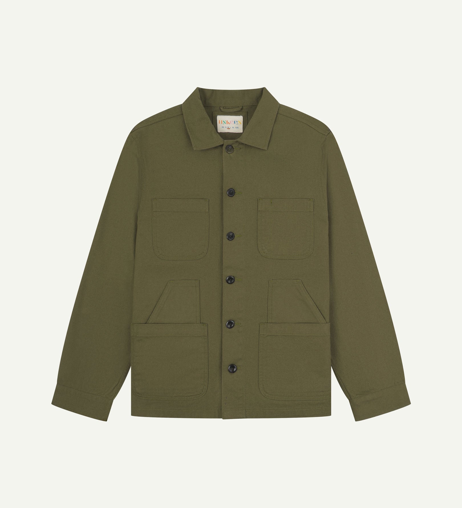 Moss-green buttoned organic cotton-drill overshirt from Uskees with clear view of layered patch pockets, reinforced elbows and Uskees branding label.