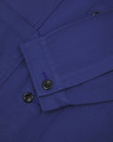 Closer detail view of multiple layered patch pockets, cuff detailing, corozo buttons and extra durable weave of the organic cotton drill fabric.