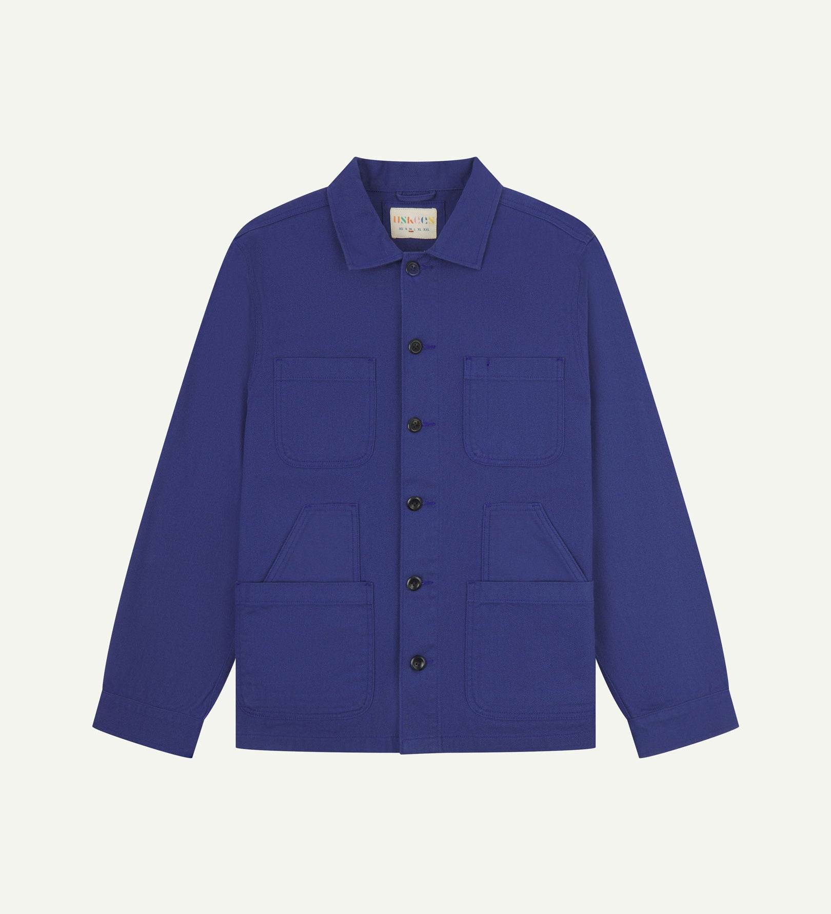 Ultra blue buttoned organic cotton-drill overshirt from Uskees with clear view of layered patch pockets, reinforced elbows and Uskees branding label.