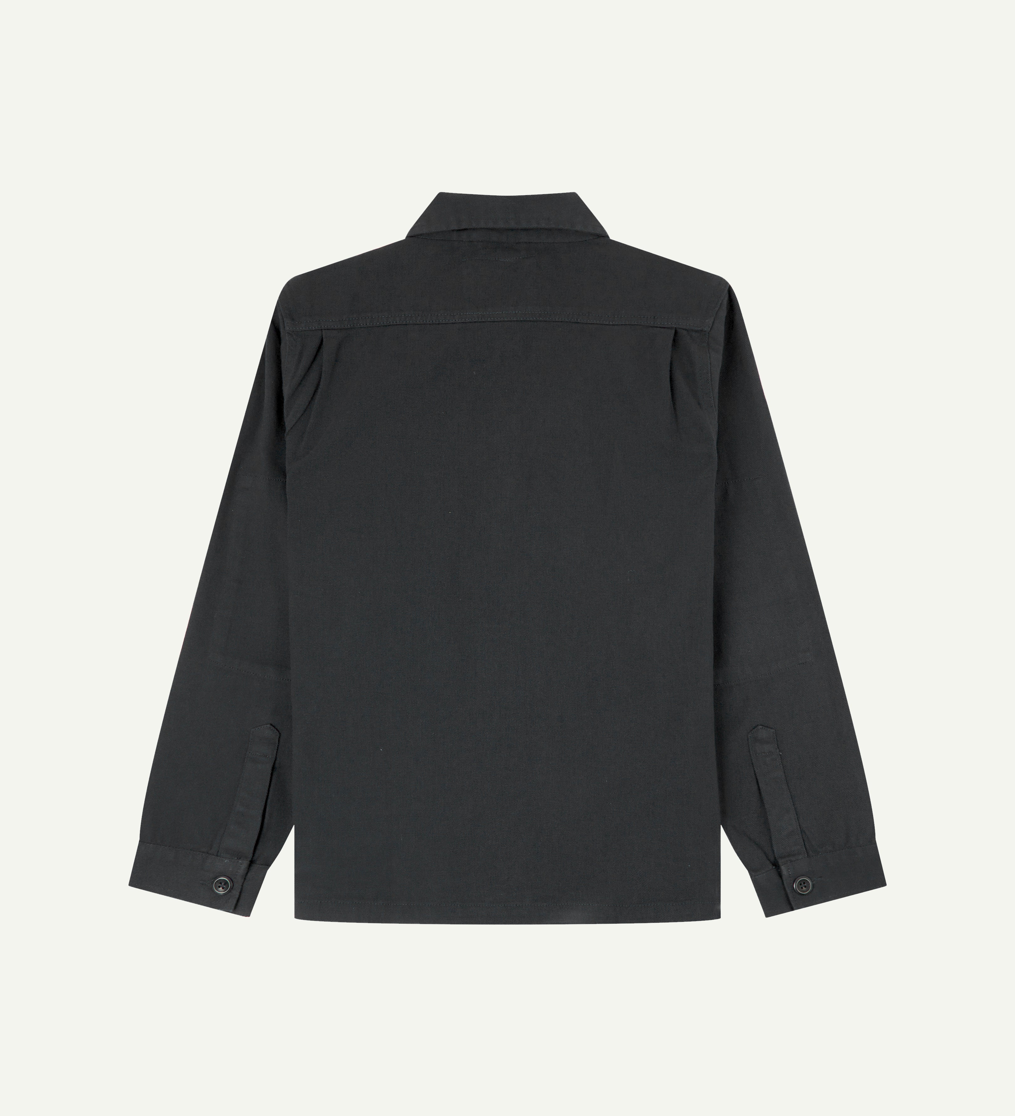 Reverse of charcoal-grey buttoned organic cotton drill overshirt from Uskees showing reinforced elbows and boxy silhouette.