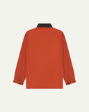 Back view of Uskees cotton canvas chore jacket in golden orange showing the pleats, metal buttoned cuffs on the cuffs and the elbow tucks.