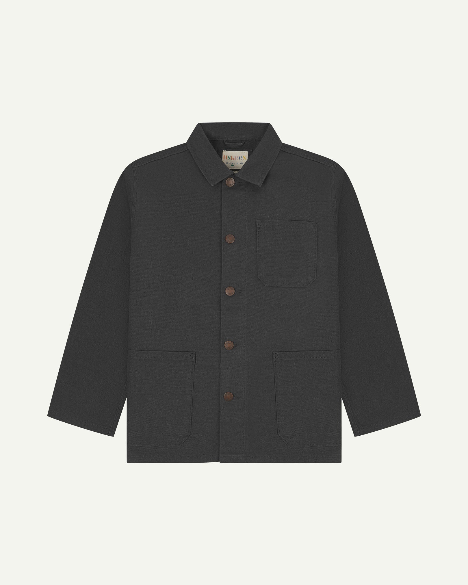 Front view of Uskees dark grey canvas men's overshirt presented buttoned up showing the 3 front pockets.