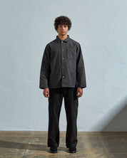 Full-length front view of model wearing 3027 charcoal organic canvas overshirt done up.