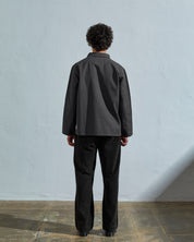 Full-length back view of model wearing #3027 charcoal-coloured organic canvas overshirt