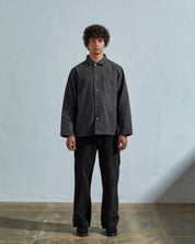 Full-length front view of model wearing #3027 charcoal organic canvas overshirt done up.