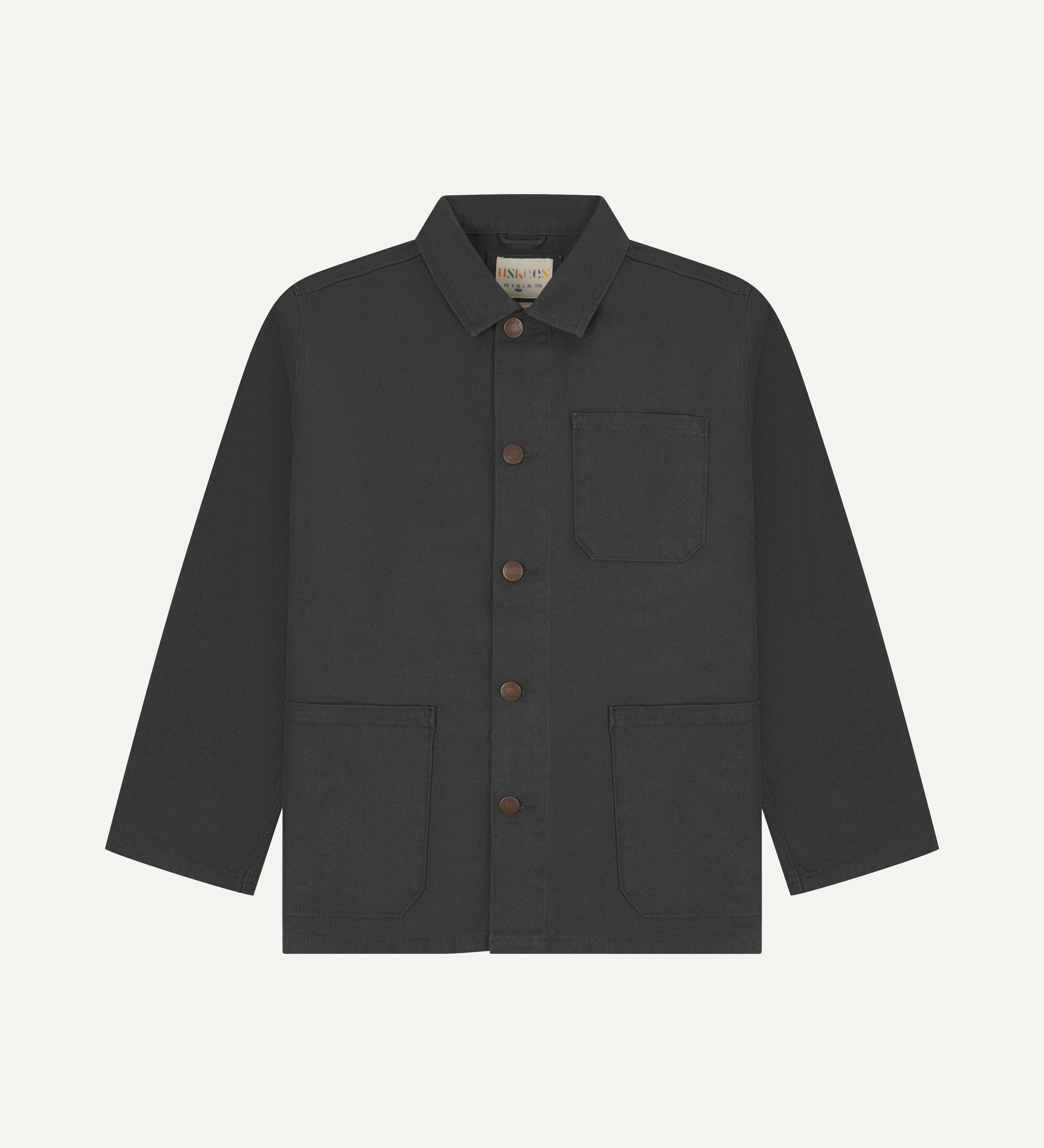 Front view of uskees dark grey canvas men's overshirt presented buttoned up showing the 3 front pockets.