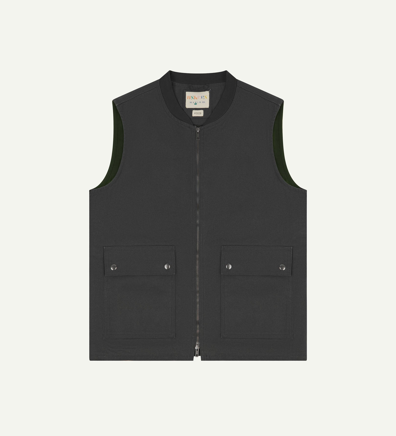Front flat shot of Uskees charcoal-grey gilet-type zip front waistcoat showing the front flap pockets and inner brand label at neck.