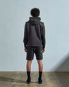 Full-length rear view of #3028, charcoal organic canvas vest from Uskees.