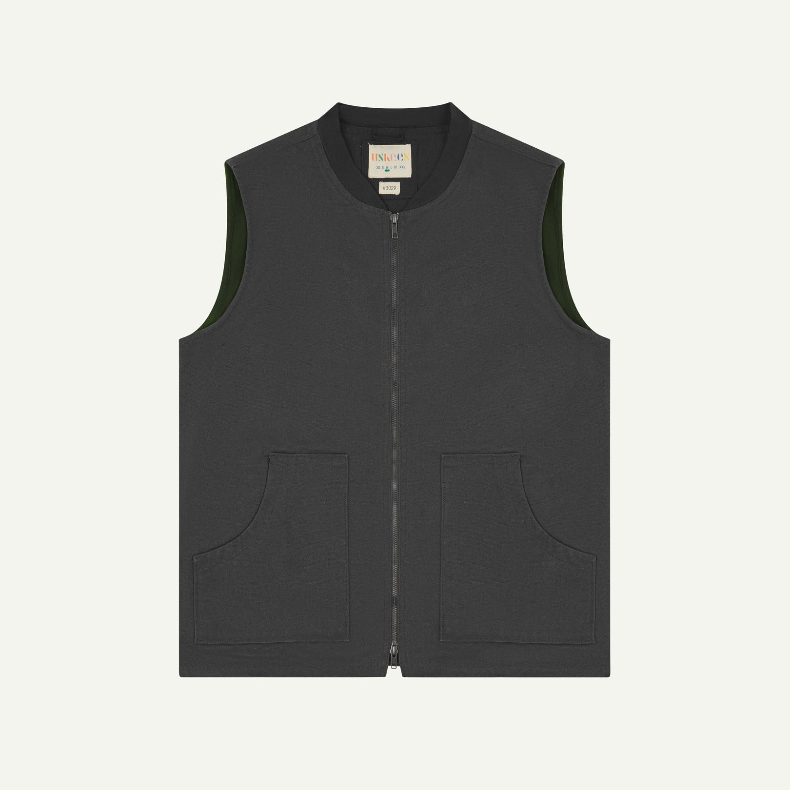 Front flat shot of Uskees charcoal-grey gilet-type zip front waistcoat showing the front patch pockets and inner brand label at neck.