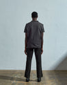 Full-length rear view of #3029, charcoal-coloured organic canvas vest.