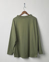 Back view of army green organic cotton #3032 jersey tie neck smock by Uskees. Presented on hanger against white background.