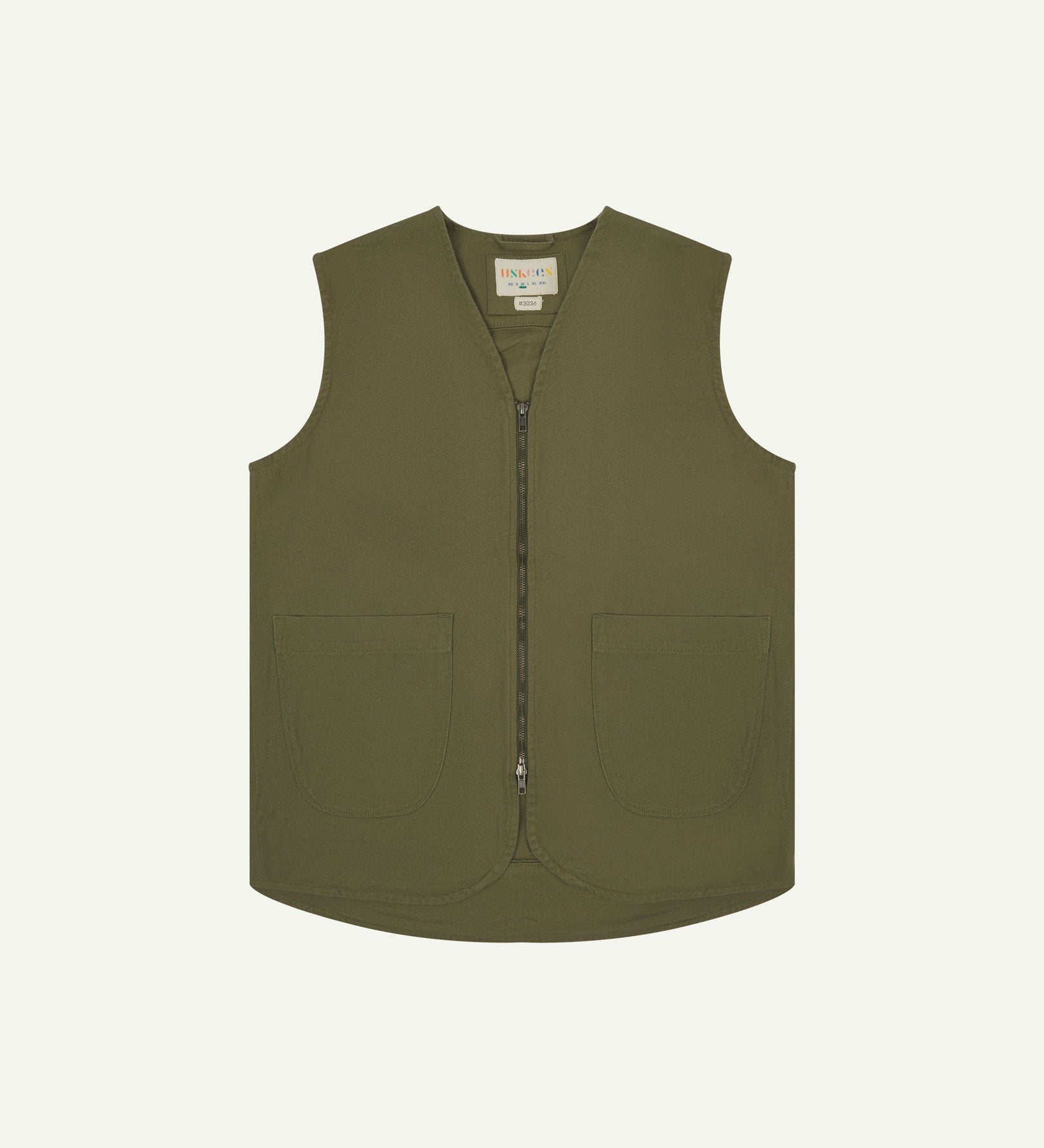 Full-length front view of Uskees #3036 moss-green organic cotton-drill vest. Fully zipped and showing clear view of curved patch pockets and branding label.
