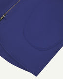 Close-up bottom-half view of #3036 ultra blue organic cotton-drill vest with focus on curved pocket detail.