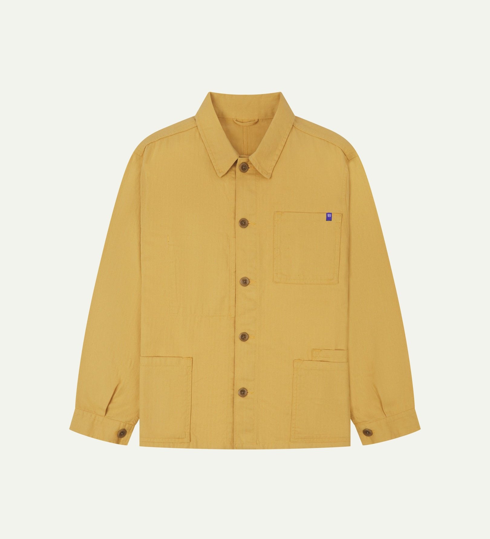 Full front view of Uskees sandstone-yellow organic herringbone cotton engineer jacket with 2 deep hip pockets with internal ticket pocket and chest pocket..