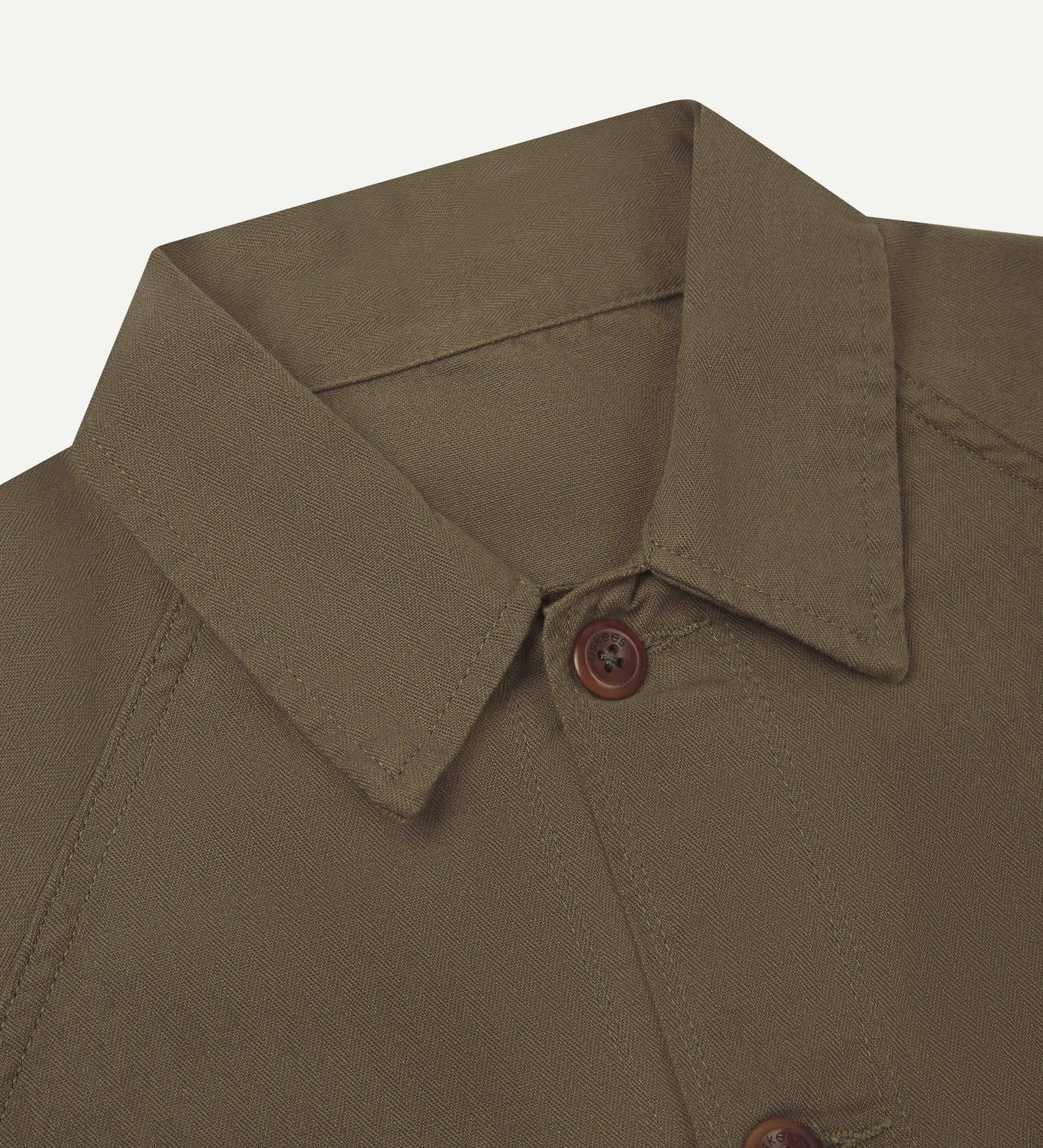 Close-up and angled front view of the 3041 signal jacket showing the herringbone cotton texture, collar and double stitch placket.