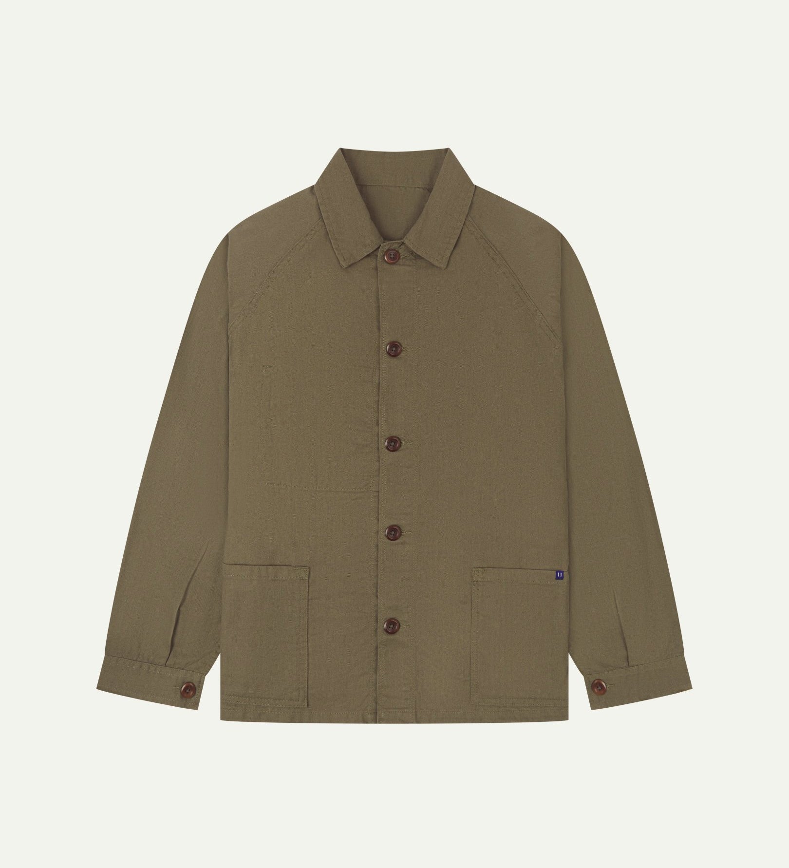 Flat front view of organic cotton dark taupe signal jacket from Uskees. Clearly showing the corozo button fastening and 2 deep hip pockets.