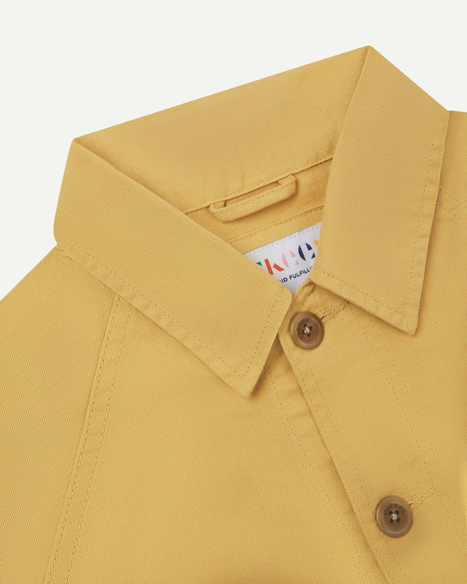 Close-up and angled front view of the 3041 signal jacket showing the herringbone cotton texture, collar and double stitch placket.