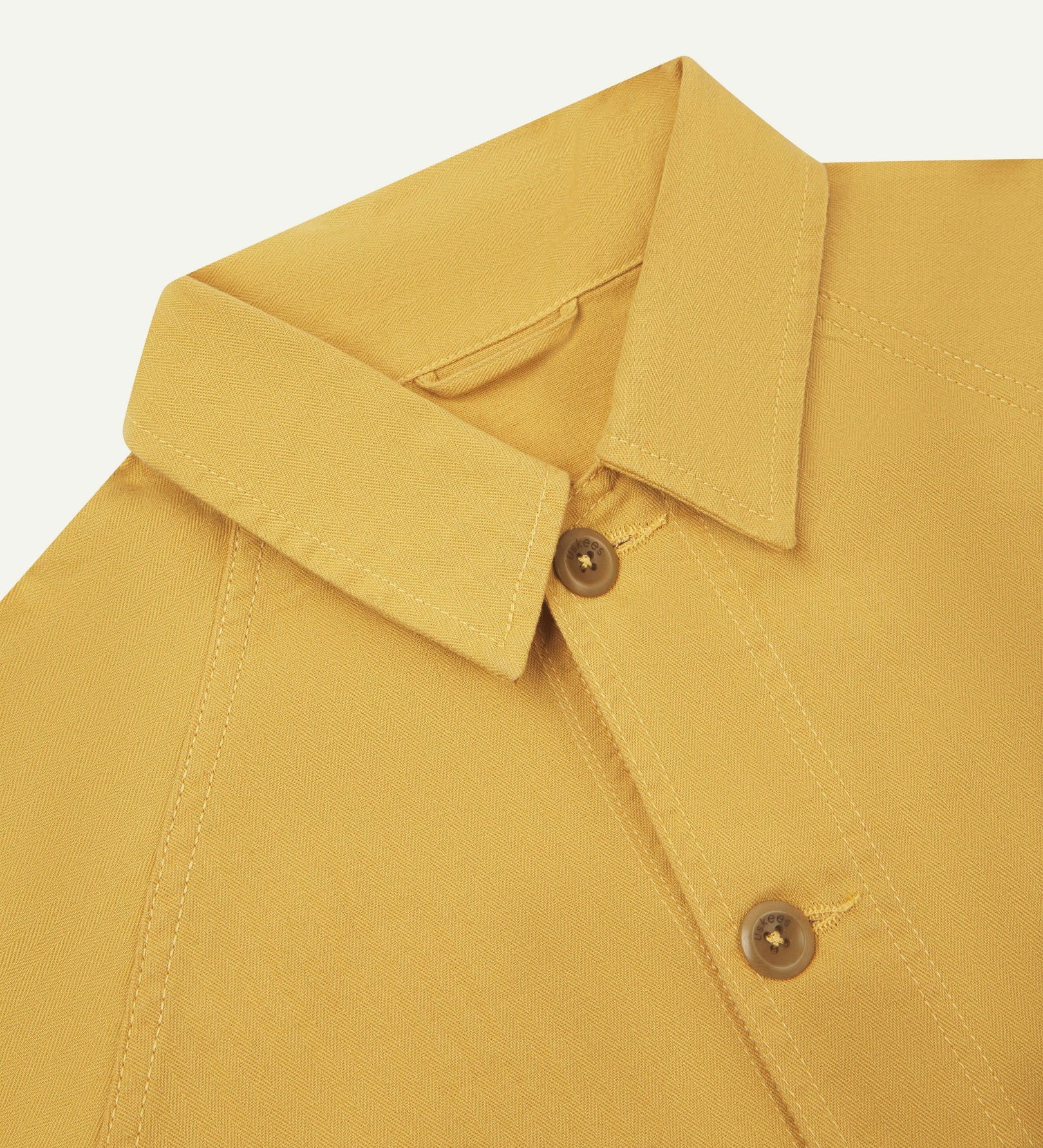 Close-up and angled front view of the 3041 signal jacket showing the herringbone cotton texture, collar and double stitch placket.