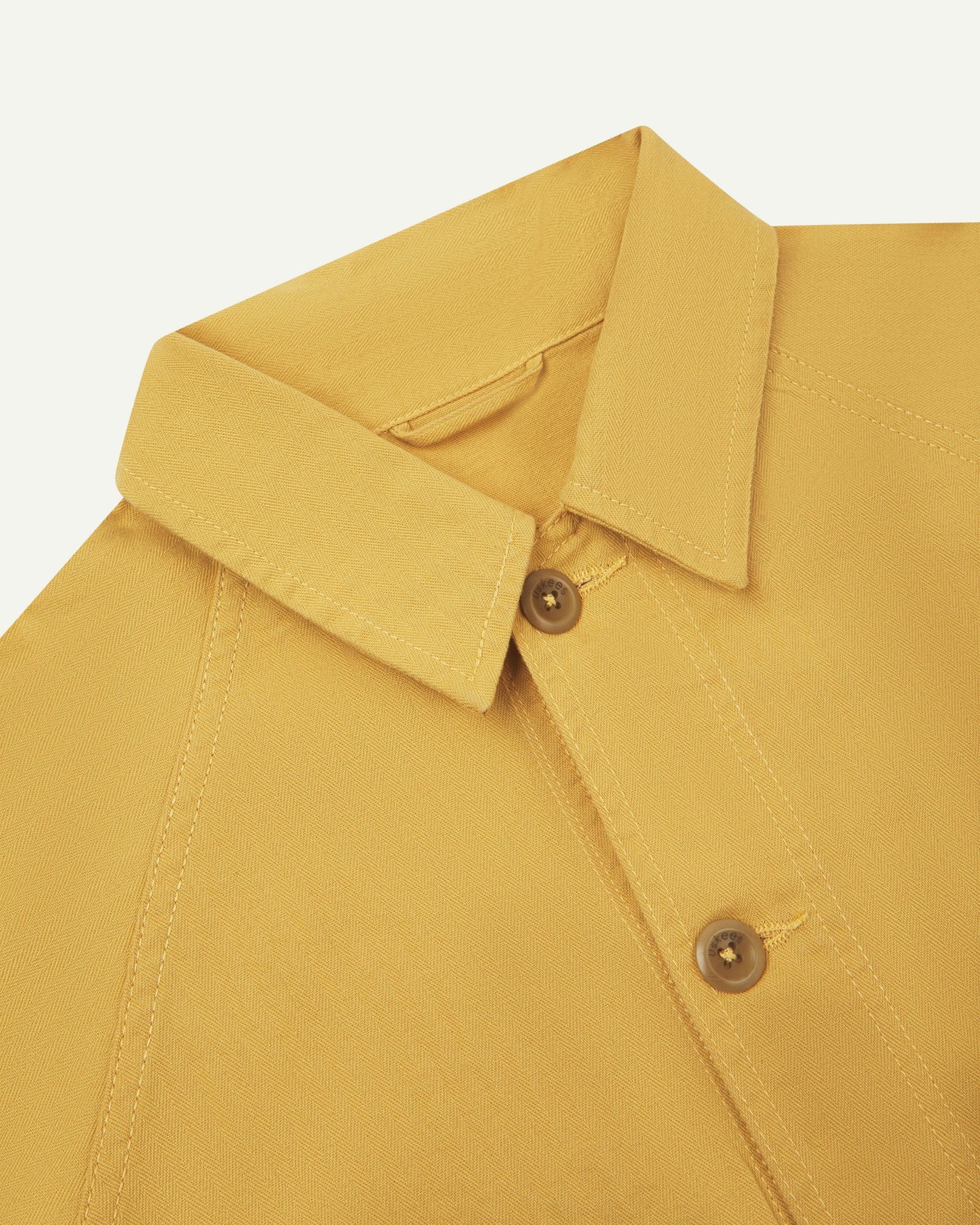 Close-up and angled front view of the 3041 signal jacket showing the herringbone cotton texture, collar and double stitch placket.