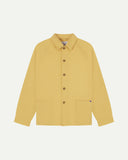 Flat front view of organic cotton sandstone-yellow signal jacket from Uskees. Clearly showing the corozo button fastening and 2 deep hip pockets.