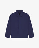 Flat front view of organic cotton deep indigo signal jacket from Uskees. Clearly showing the corozo button fastening and 2 deep hip pockets.