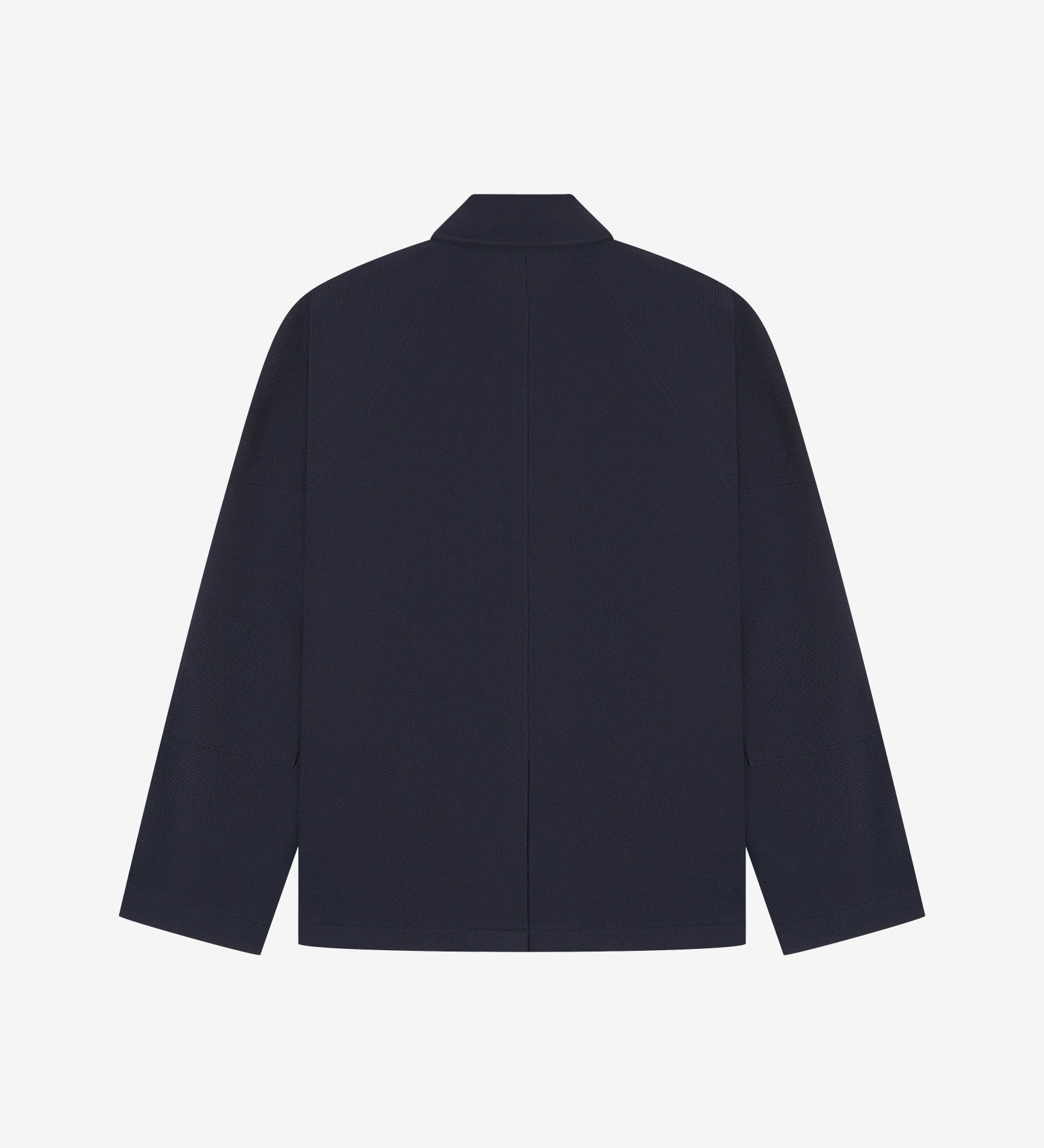 Flat back view of knitted organic cotton midnight blue blazer from Uskees with view of vent and reinforced elbows.