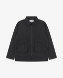 Front view of Uskees black ripstop field jacket showing the chest zip pockets and gusseted pockets with flaps.