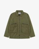 Front view of Uskees ivy green ripstop field jacket showing the chest zip pockets and gusseted pockets with flaps.